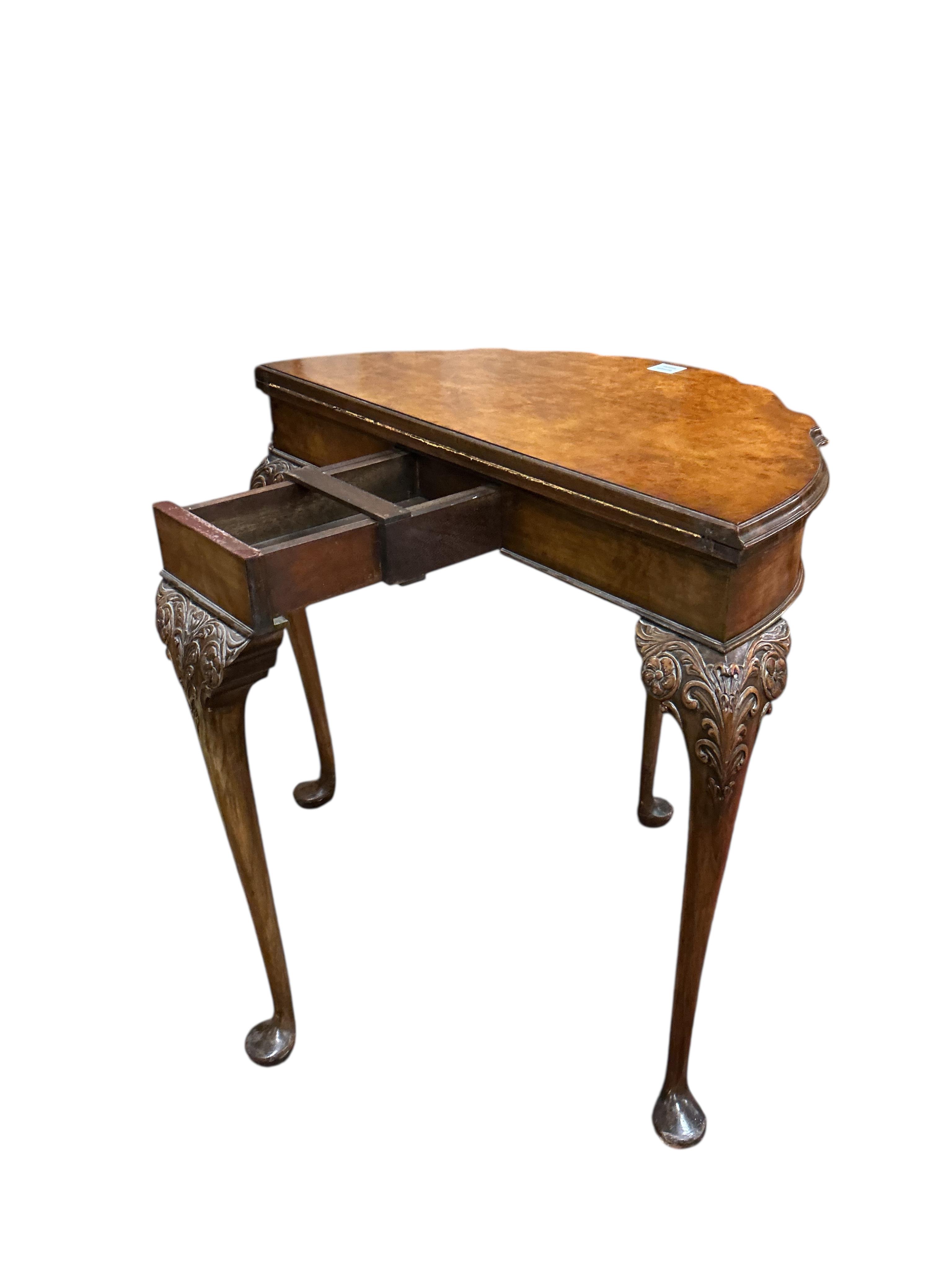 A Queen Anne Revival walnut folding card table, width 88cm, depth 44cm, height 74cm